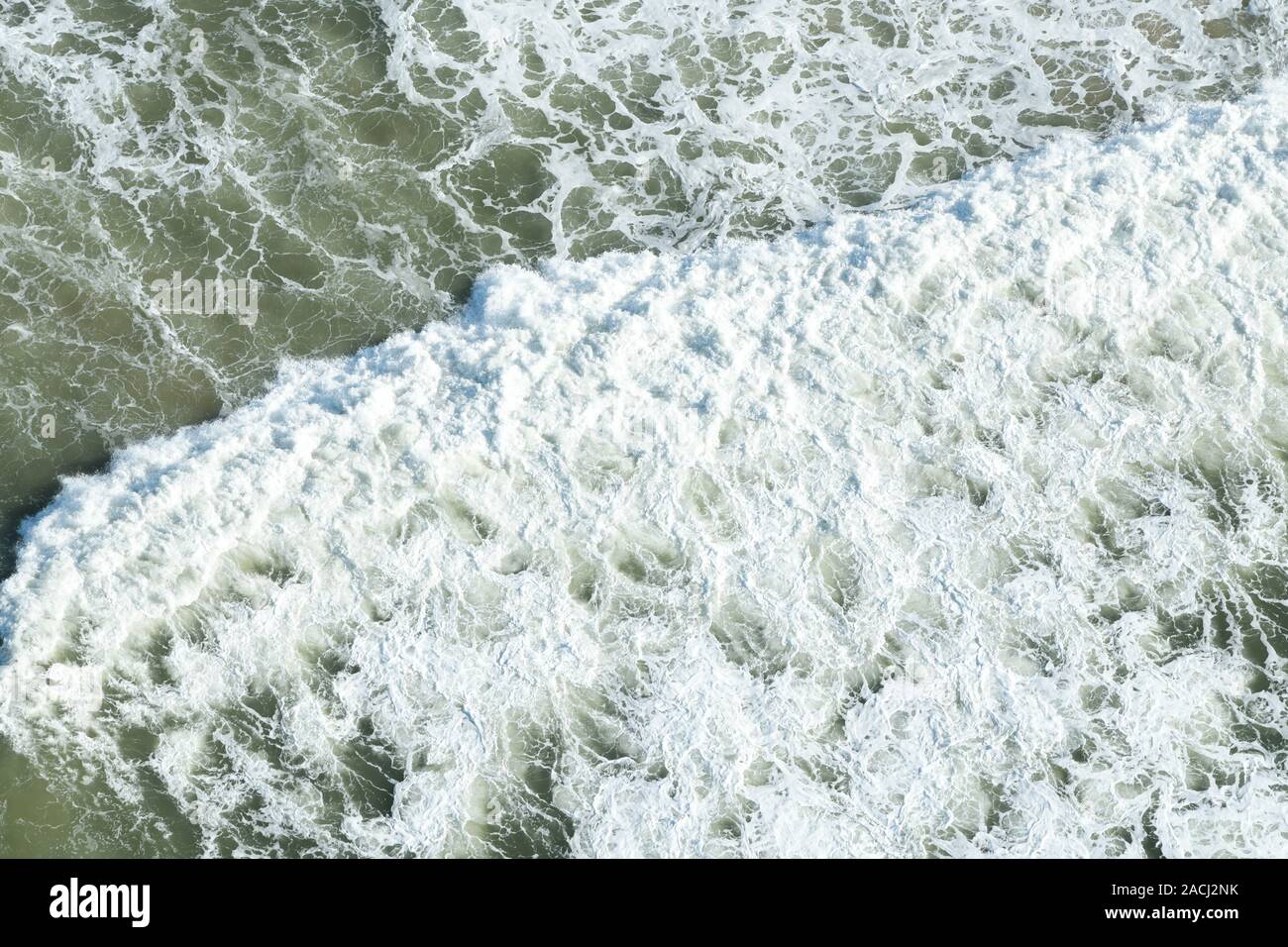 Beauty in nature, foam froth of breaking wave, aerial view, seascape, surf zone of Durban beach, South Africa, high key Stock Photo