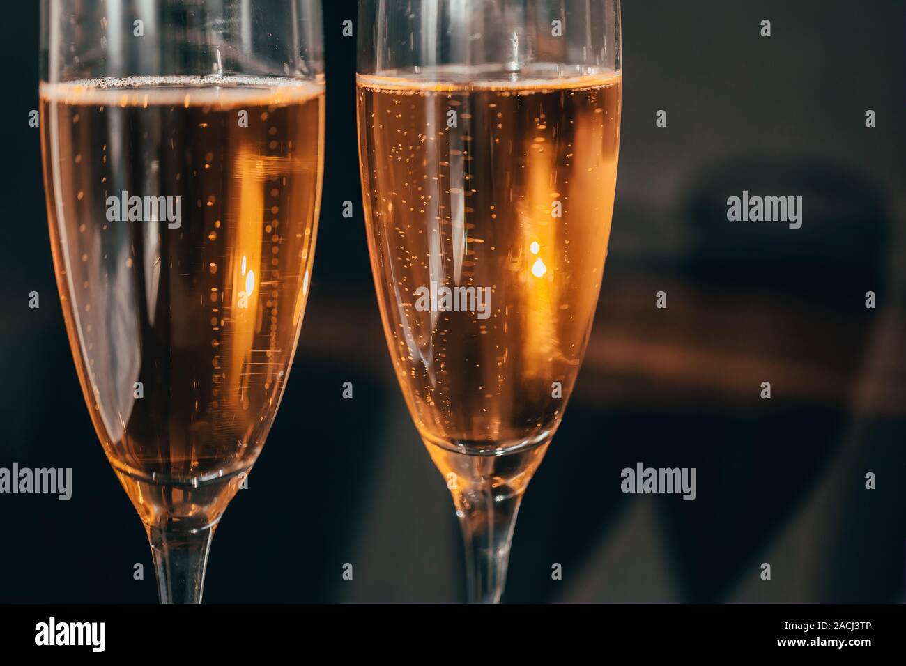 Two champagne glasses splash with drops hi-res stock photography and ...