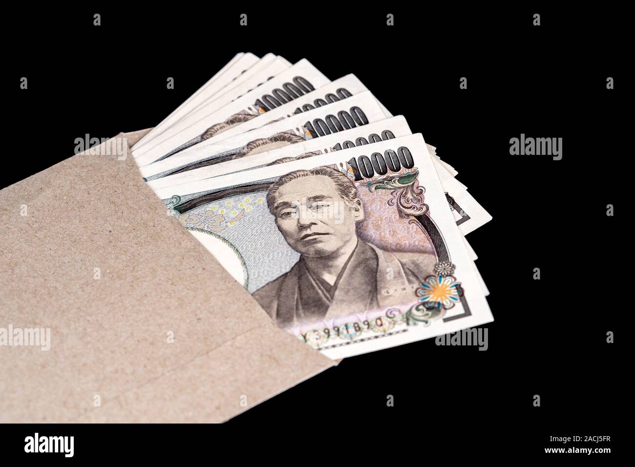 Japan money inside paper envelope on a black background Stock Photo Alamy