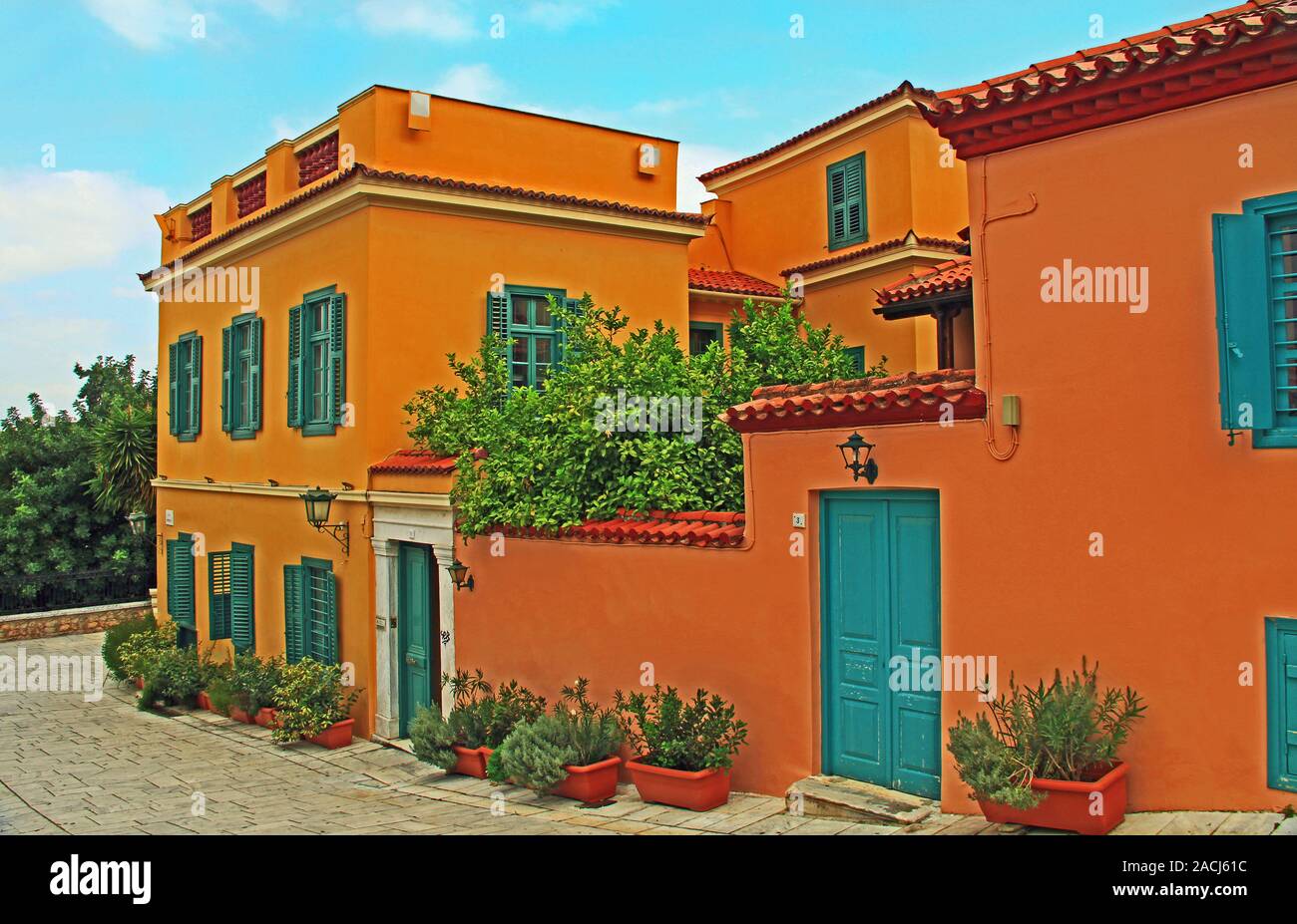 Red Shuttered Home on a Street in Athens, Greece Stock Photo