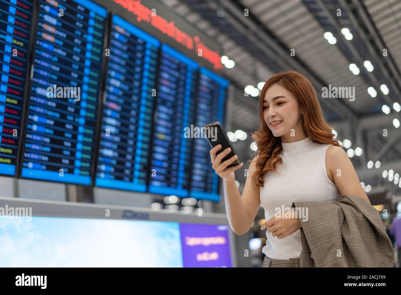 Young female passenger airport using hi-res stock photography and ...