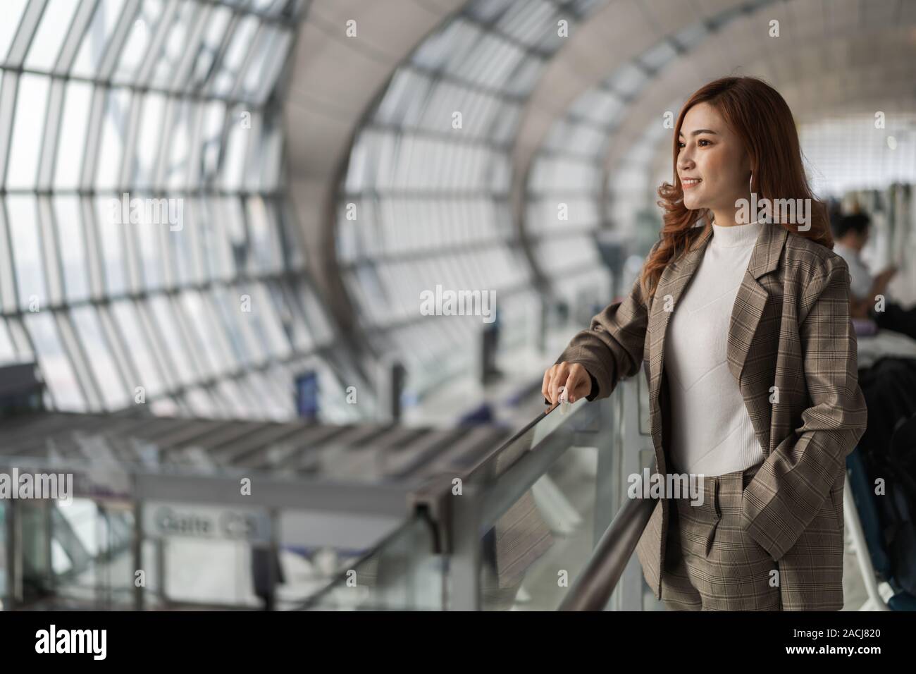 Beautiful business woman waiting airport hi-res stock photography and ...