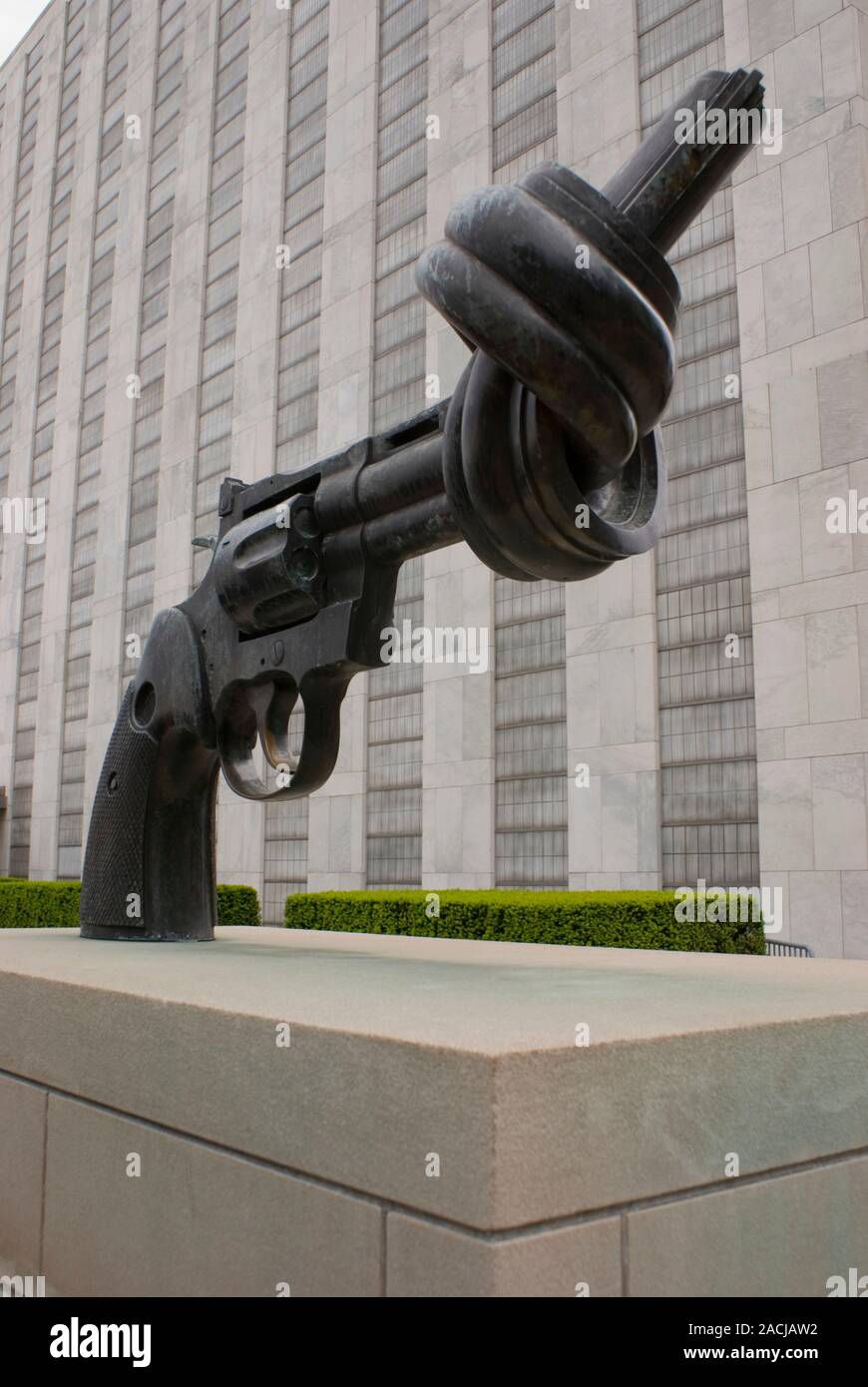 A sculpture depicting a revolver with a knot in its barrel on display ...