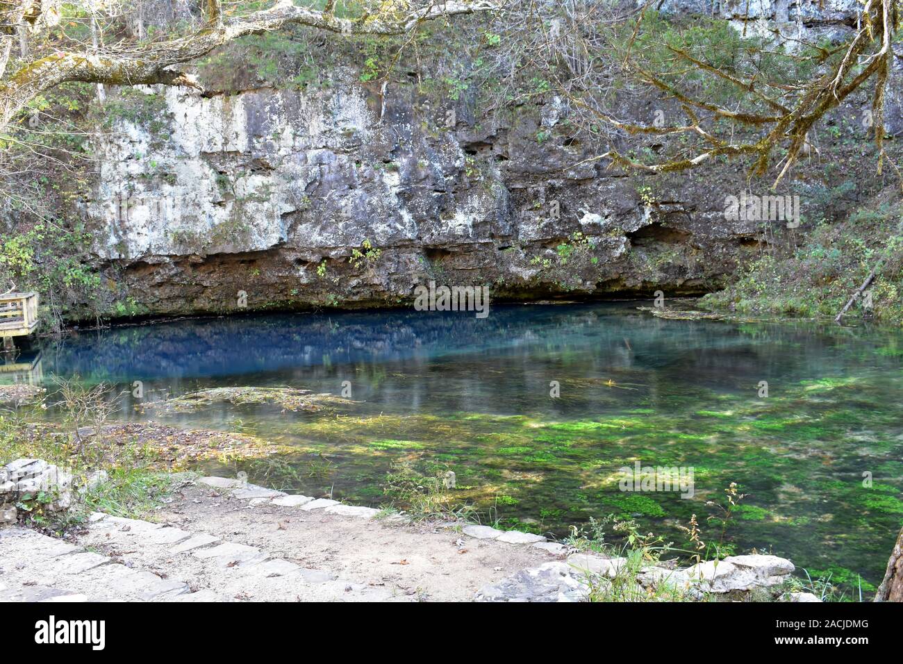 The deep blue waters of Blue Spring, on the Current River, near Eminence, MO, USA. Blue Spring is one of Missouri's deepest springs, at over 300 feet. Stock Photo