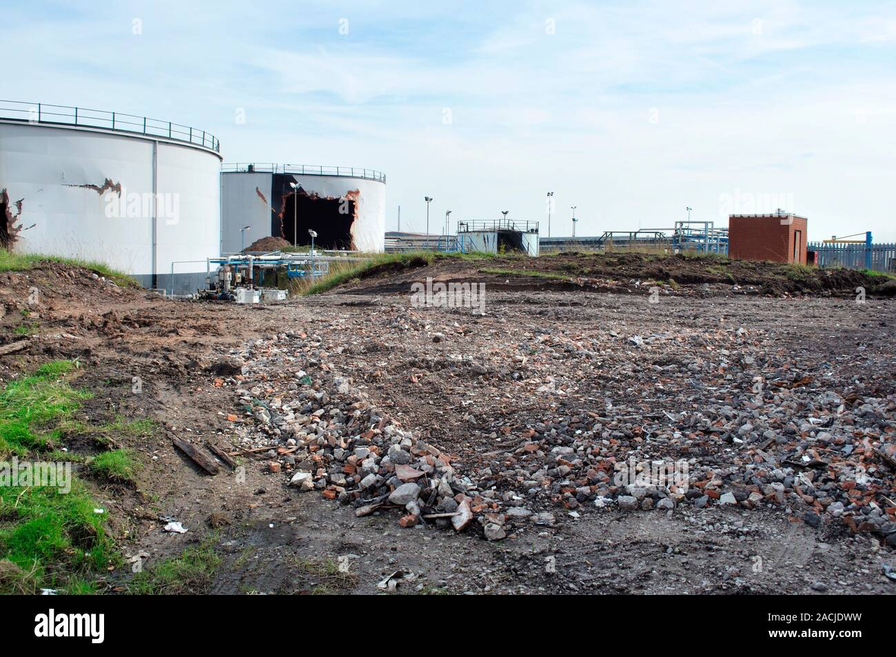 Chemical factory demolition. Rubble and derelict storage tanks during