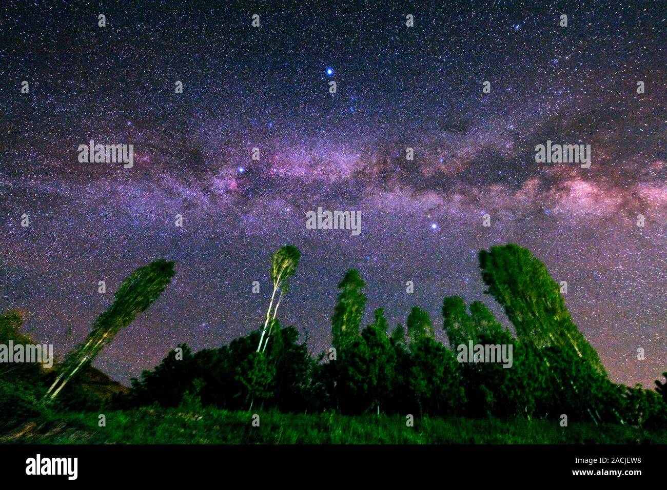 Our home galaxy, the Milky Way in a starry sky. The three bright stars ...
