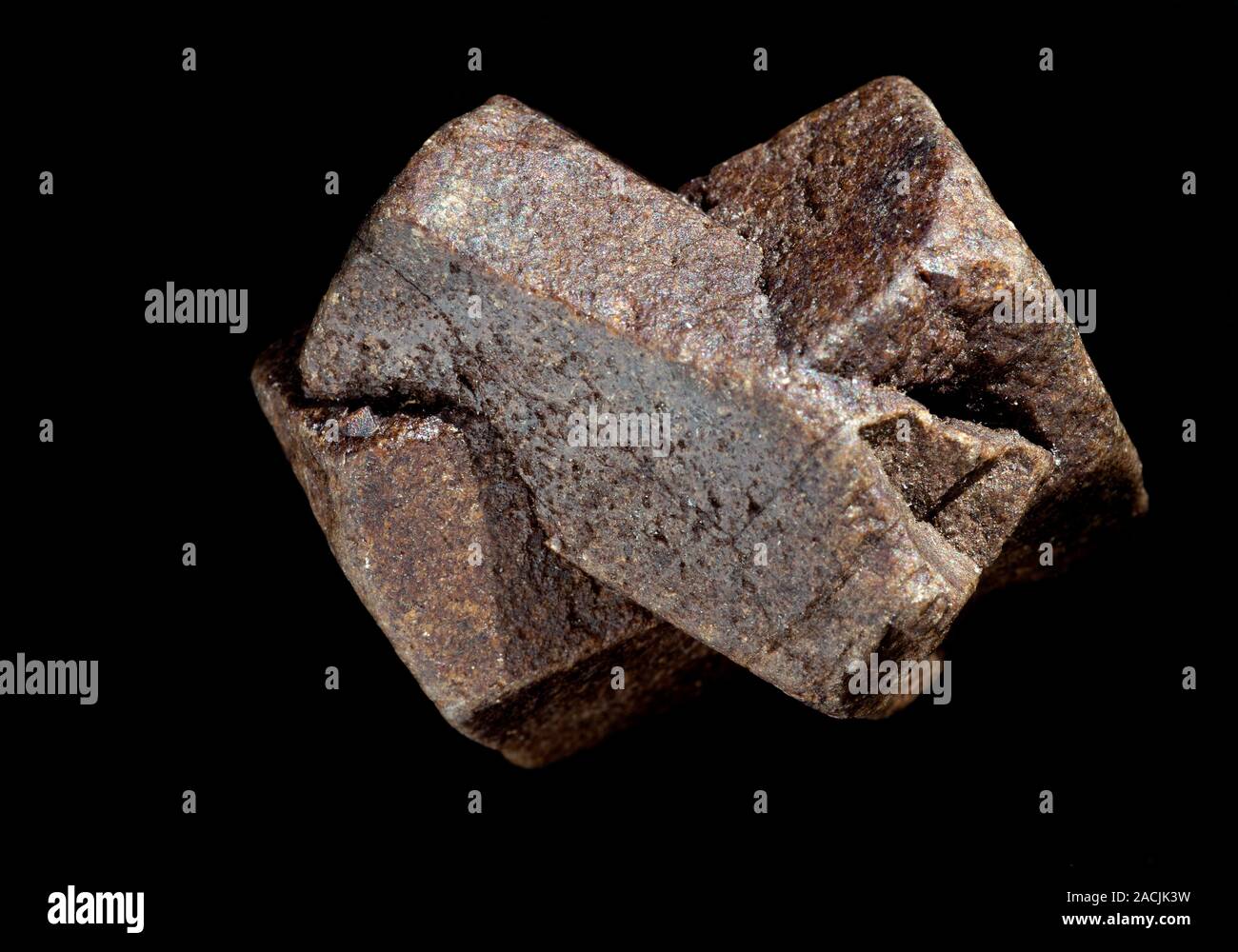 Twinned staurolite crystals. Staurolite is a hydrated aluminium
