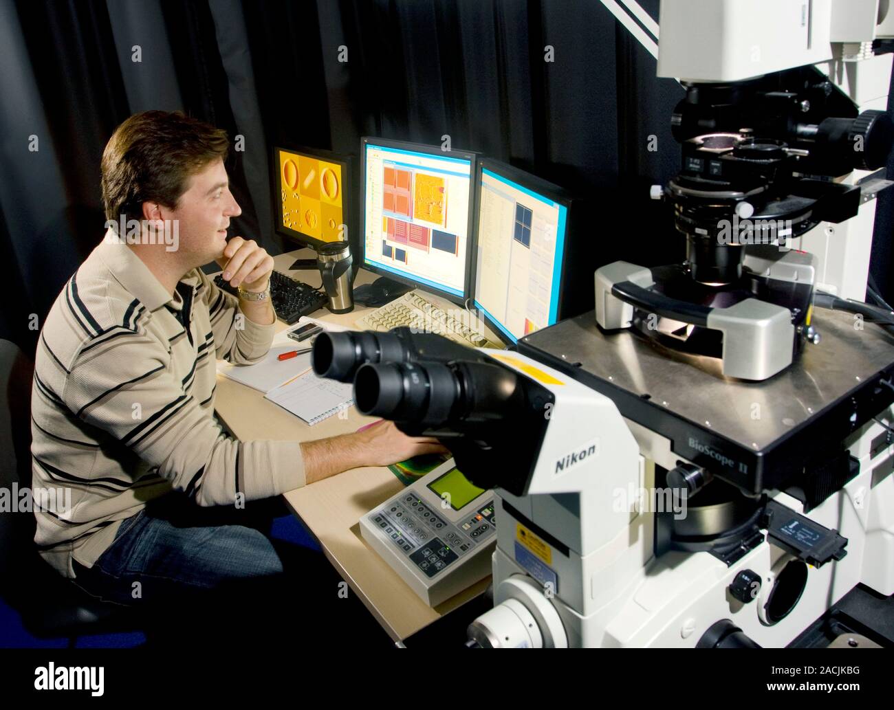 Biological nanosystems research. Researcher using an atomic force ...