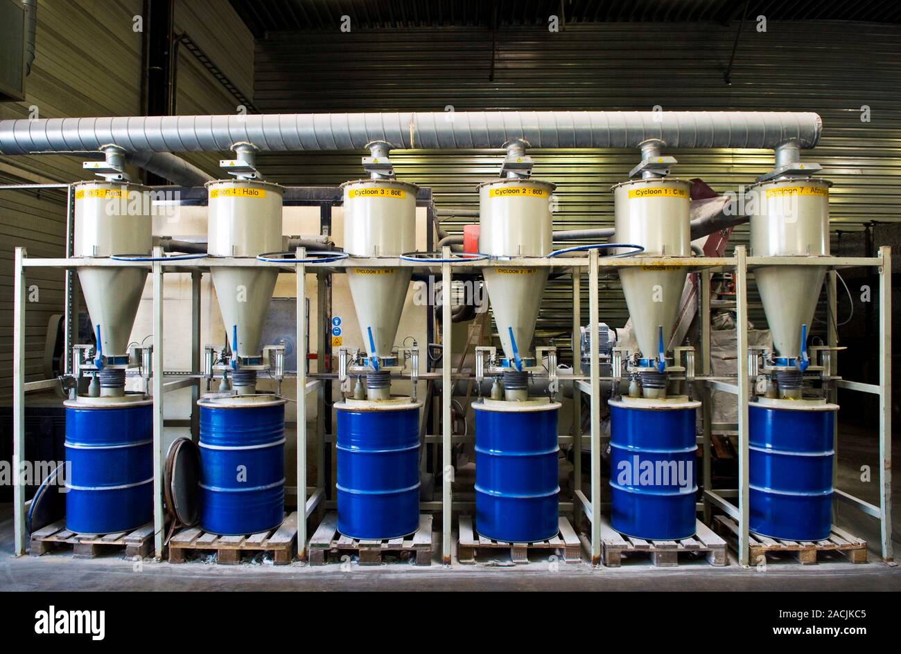 Light bulb recycling plant. Automated machine used to recycle fluorescent light tubes at a