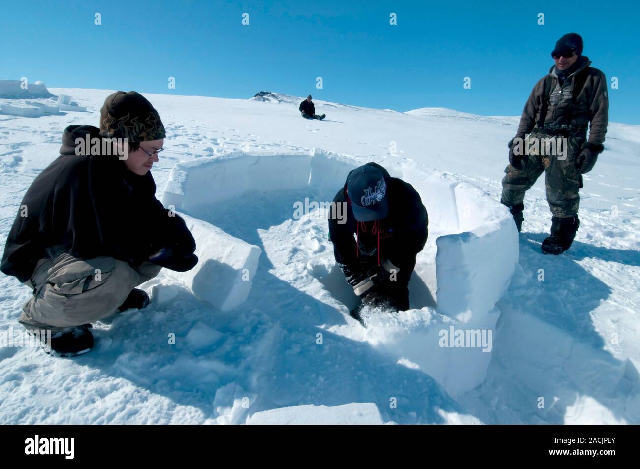 Igloo building, arctic. Expedition travellers learning how to build a