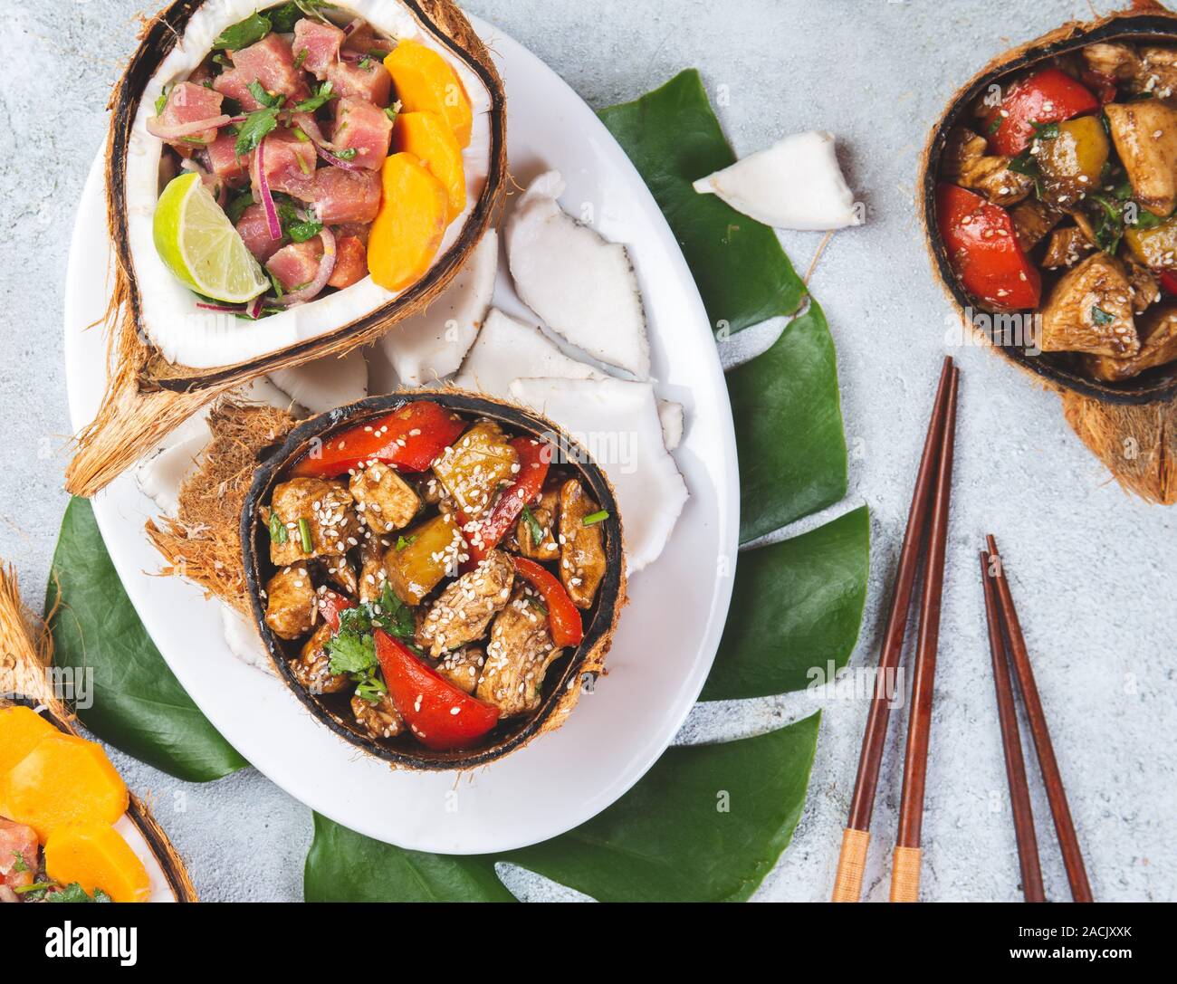 Tahitian Hawaiian dishes Thuna ceviche salad and pineapple chicken with sweet sauce Stock Photo