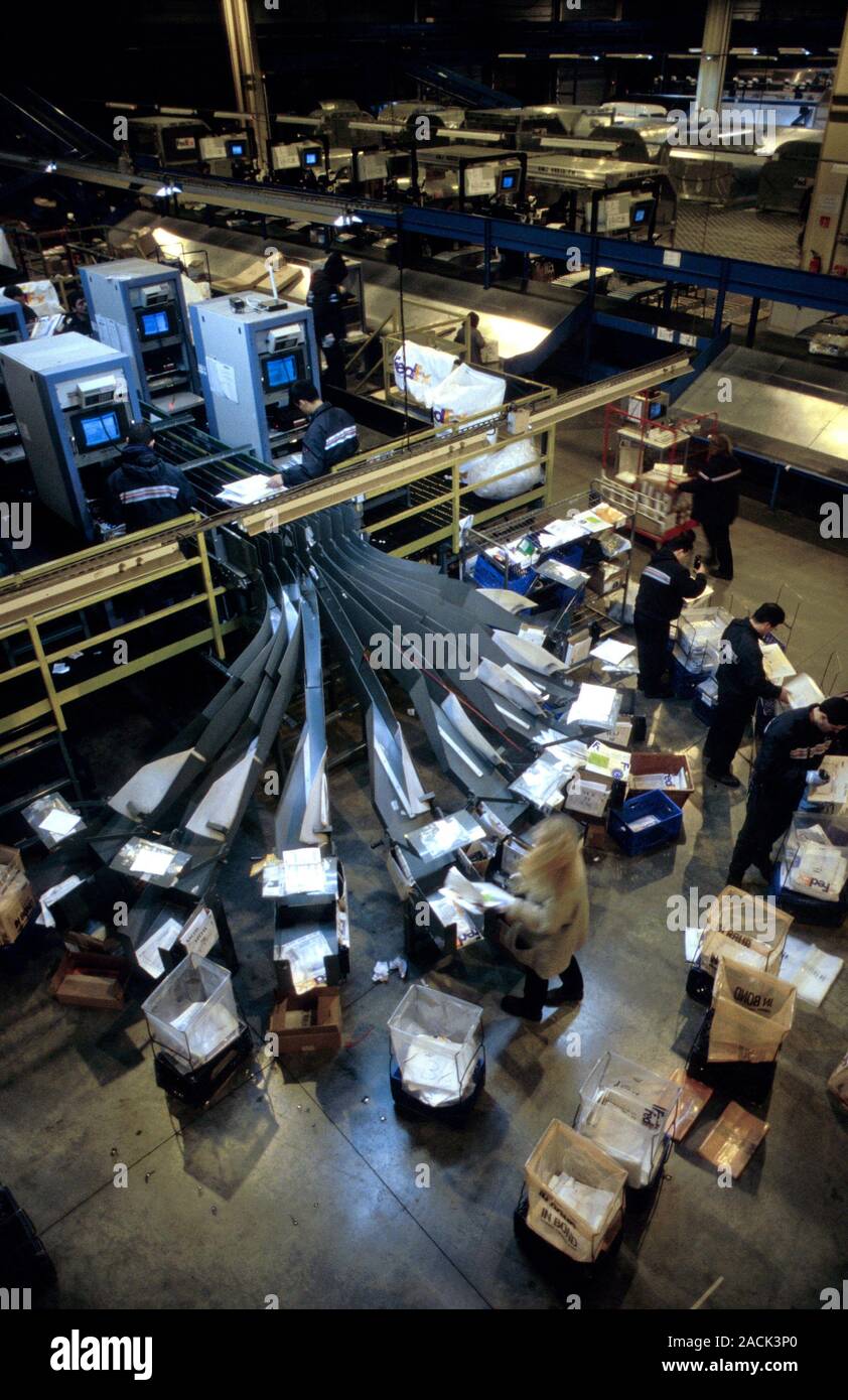 Charles De Gaulle airport. Workers in the FedEx parcel sorting room at ...