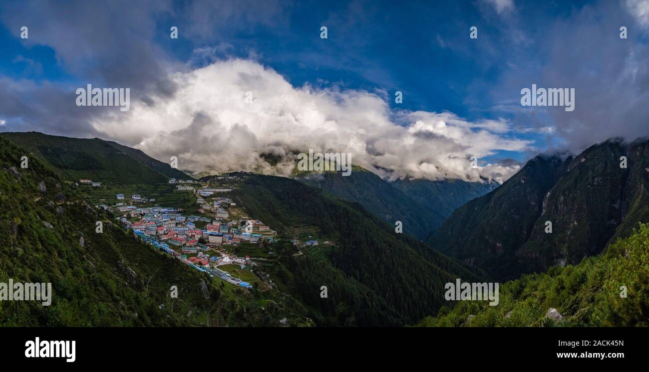 Panoramic aerial view over the town, Mt. Thamserku covered in monsoon clouds in the distance Stock Photo