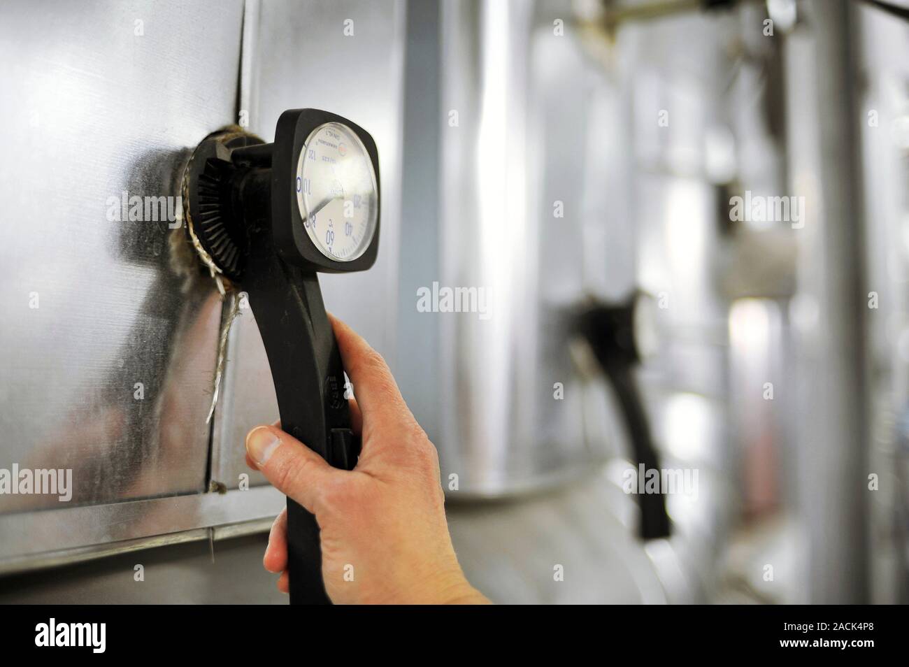 Main Engine Rack Hand Engine room. Close-up of a person's hand on a hand gear in an engine ...