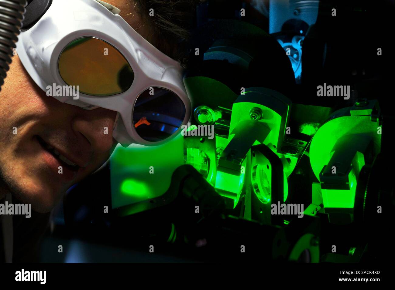 Optical science lab. Scientist working with equipment used for