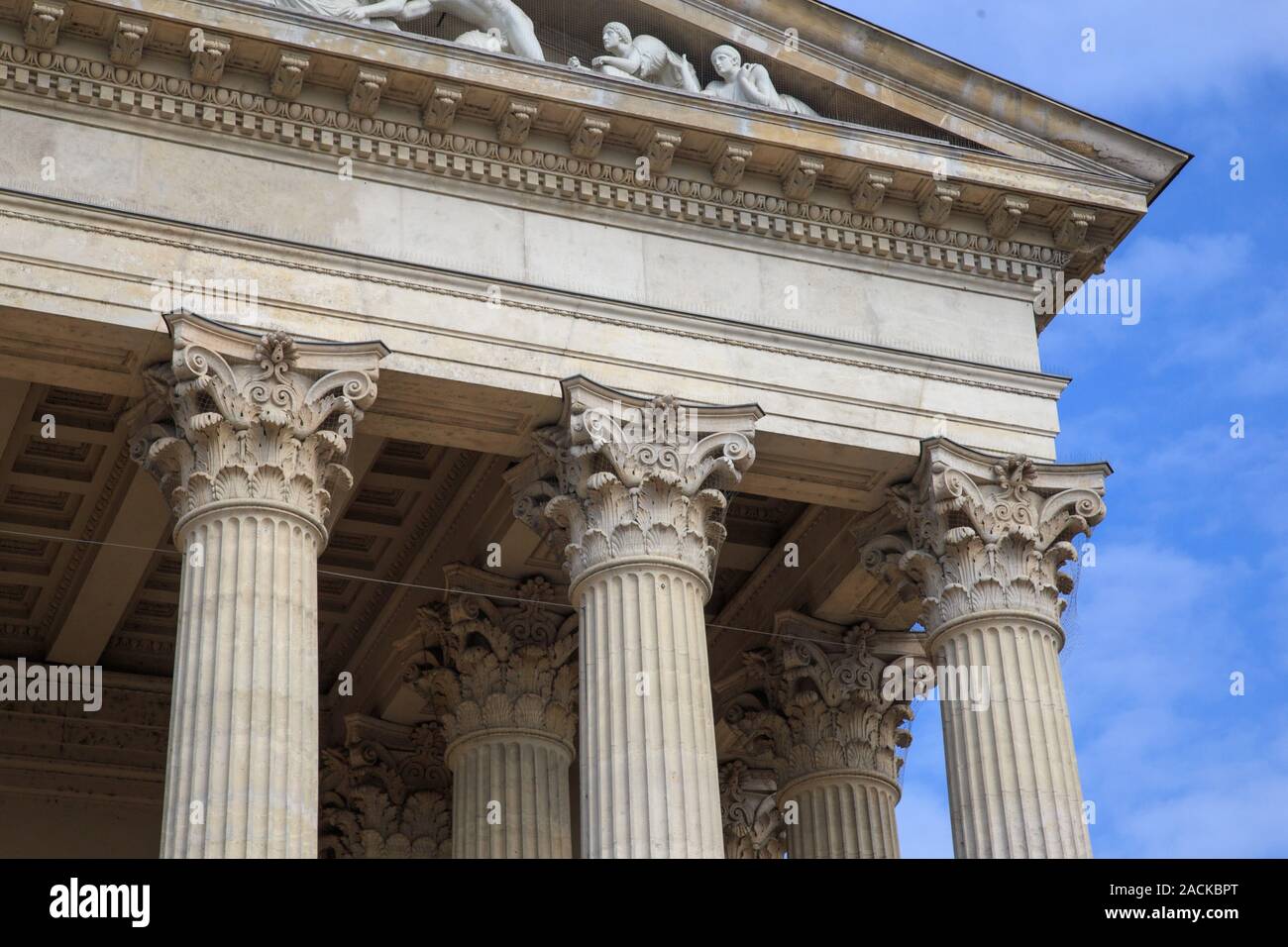 Vintage Old Justice Courthouse Column. Neoclassical colonnade with corinthian columns as part of a public building resembling a Greek or Roman temple. Stock Photo
