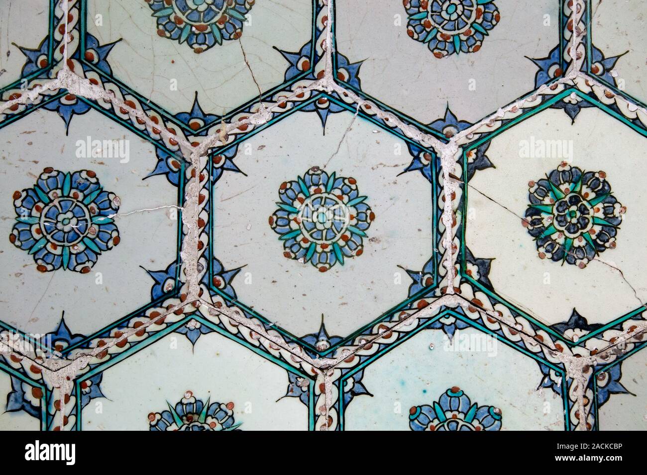Handmade old Turkish Blue ceramic Tiles on the wall in Istanbul City, Turkey. Close up. Ancient Ottoman patterned Iznik syle design tile composition. Stock Photo