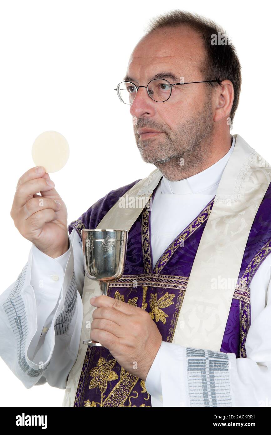 Catholic priest with chalice Stock Photo