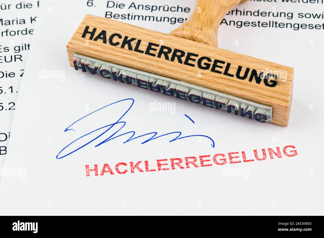 Wooden stamp on document: Hackler regulation Stock Photo