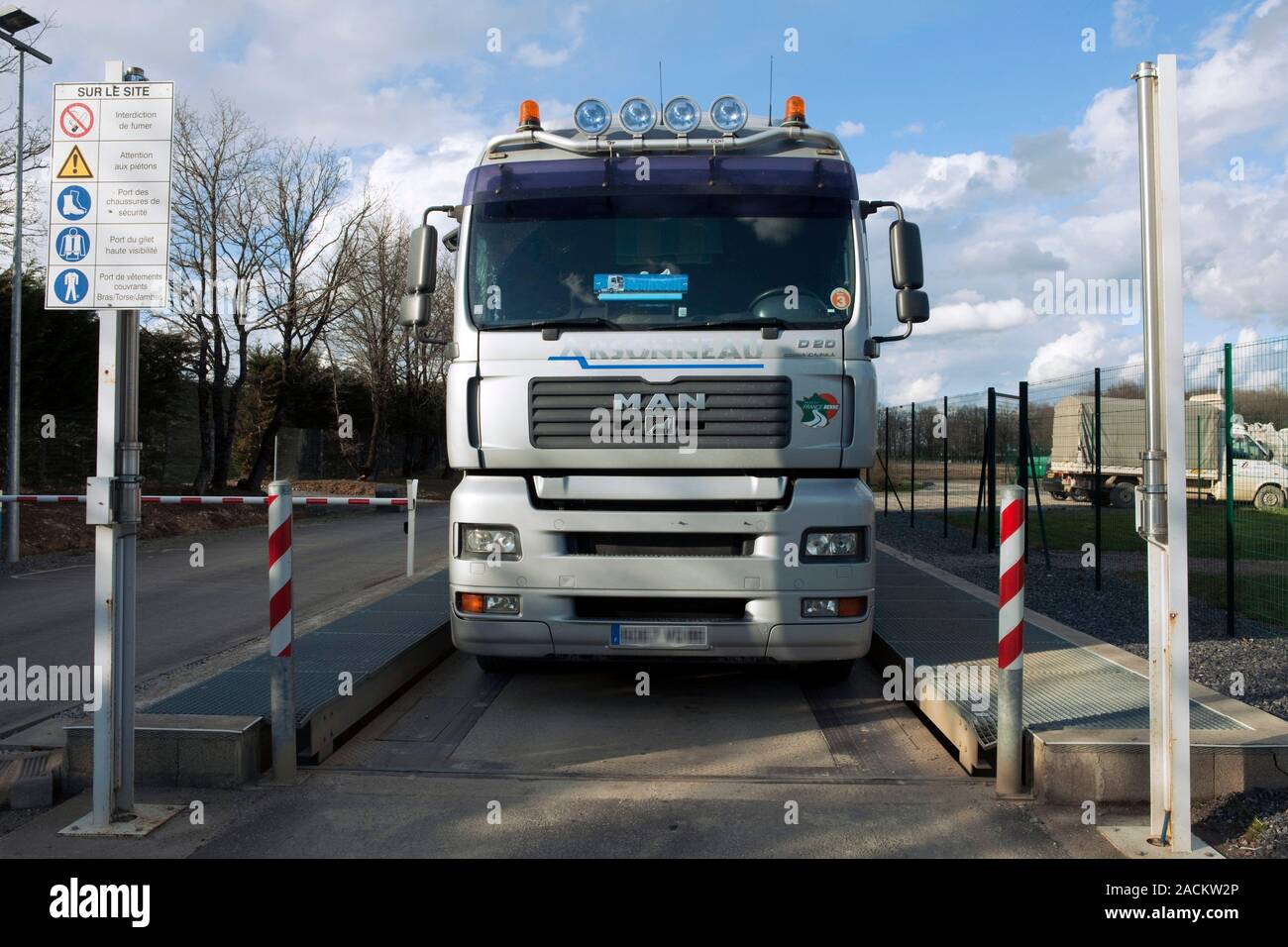 Radiation detection in waste. Waste disposal vehicle being weighed and