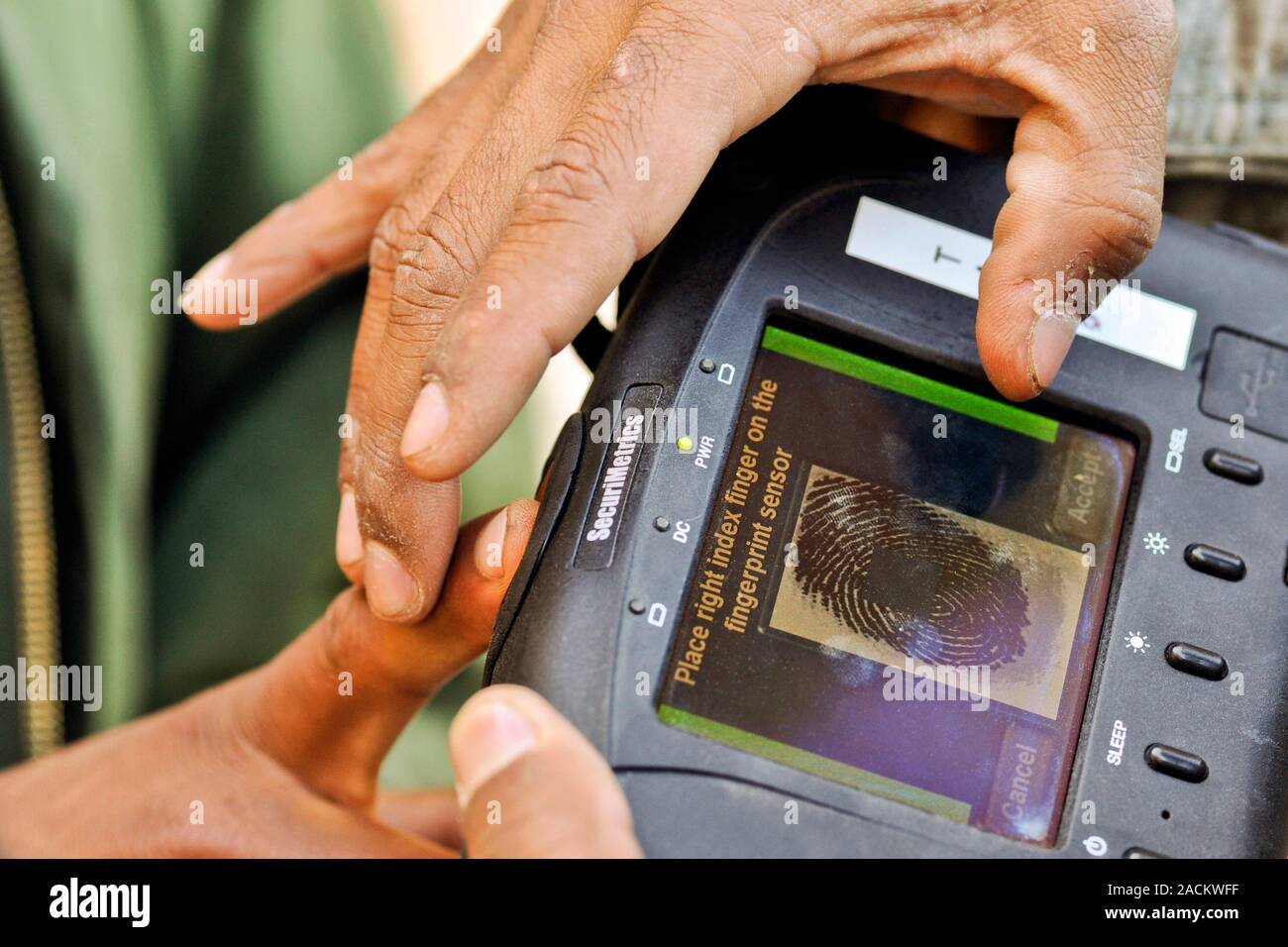 Military biometrics. Biometric fingerprint scanner being used by a US