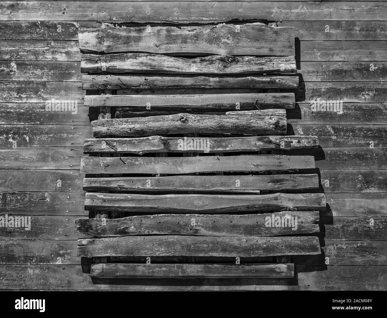 Old wood house wall with close window, covered with planks Stock Photo Alamy