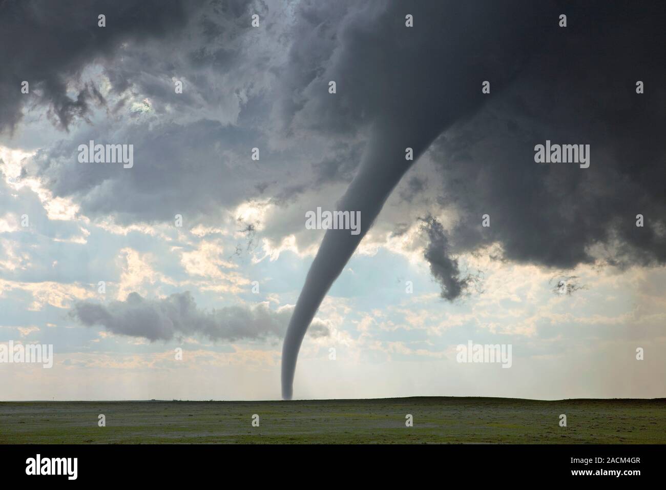 Tornado on the Great Plains of the USA. A tornado is a rapidly rotating ...