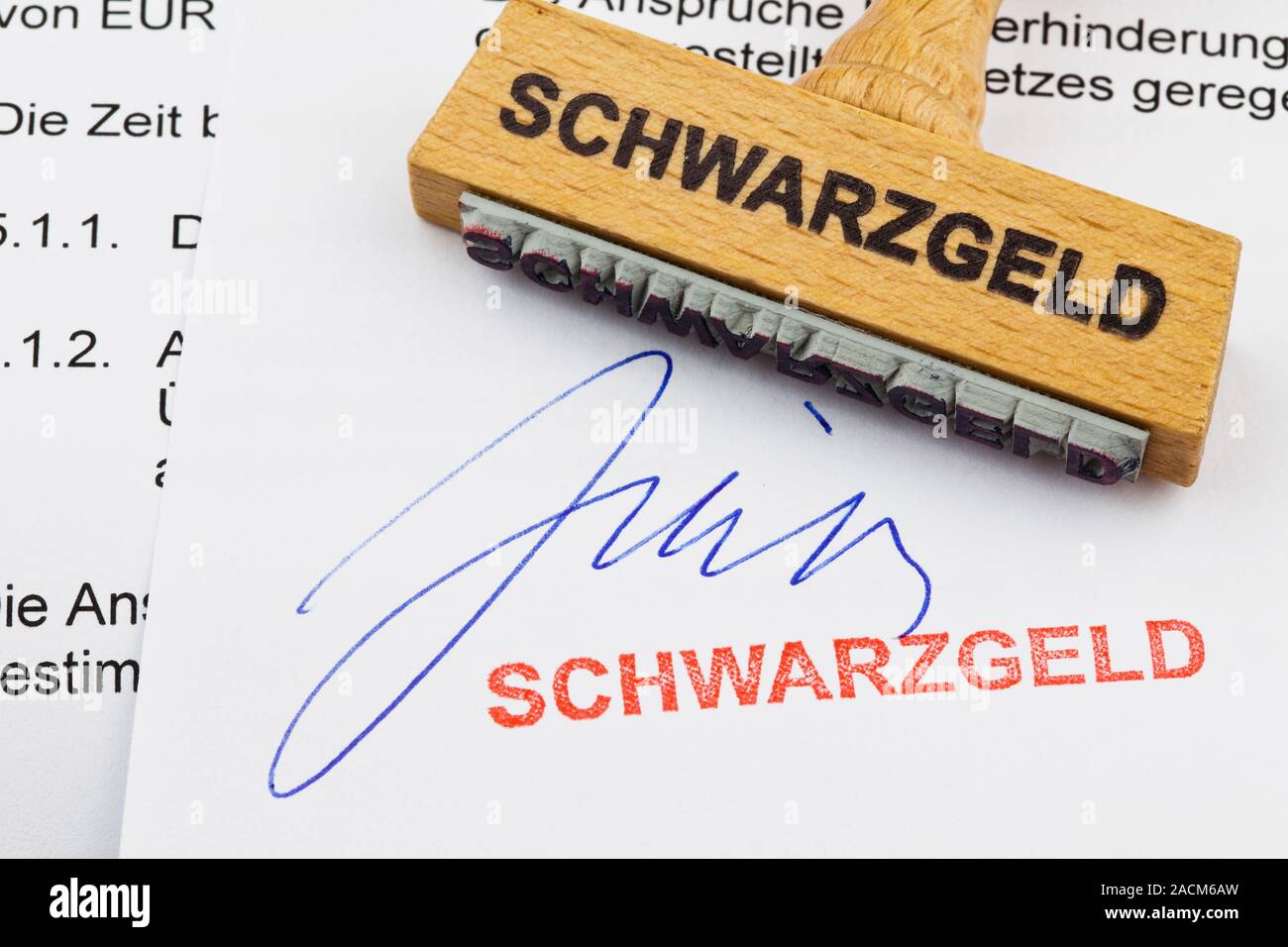 Wood stamp on document: Schwarzgeld Stock Photo