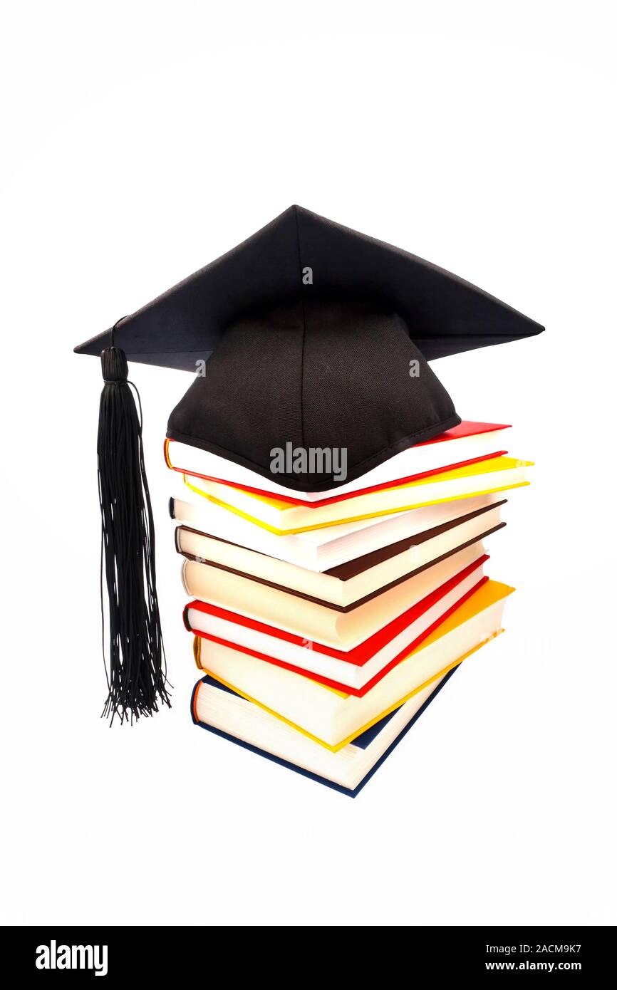 Doctor's hat on a book stack Stock Photo - Alamy