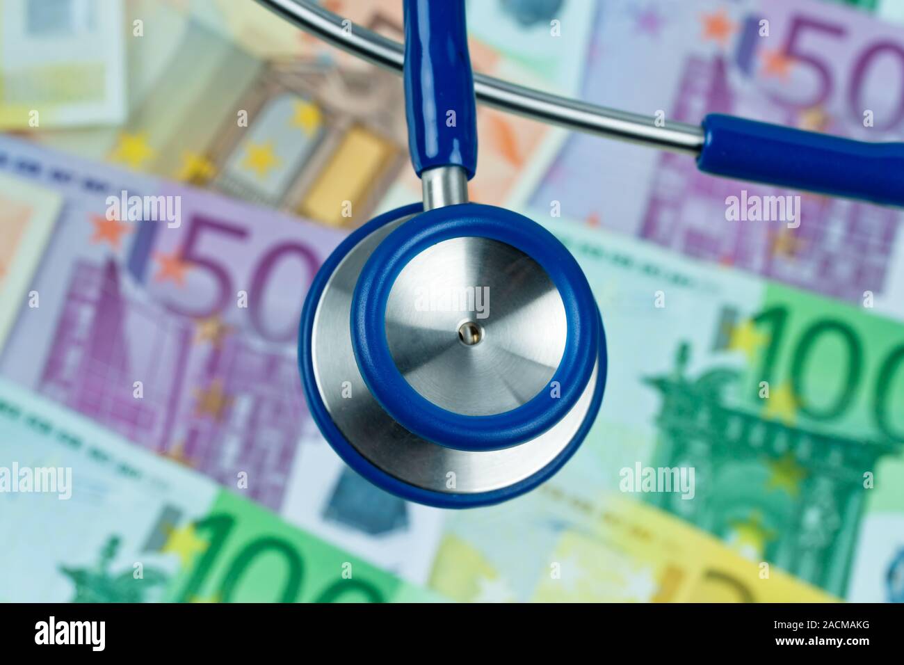 Many Euro banknotes with stethoscope. Costs health Stock Photo Alamy