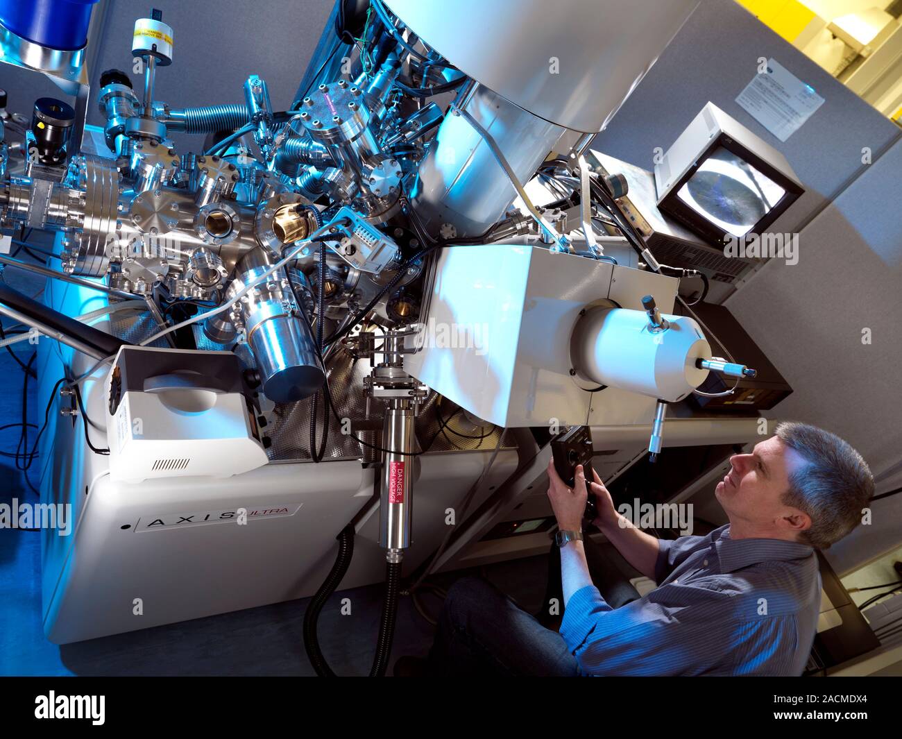 Xray materials analysis equipment. Researcher controlling an Xray