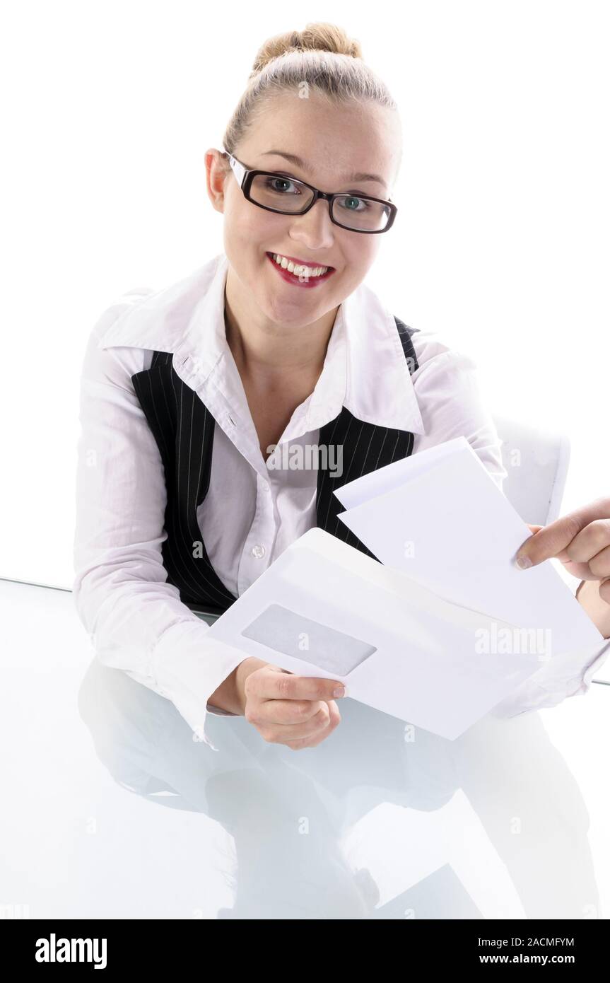 Blonde woman, manageress, secretary reading a letter Stock Photo