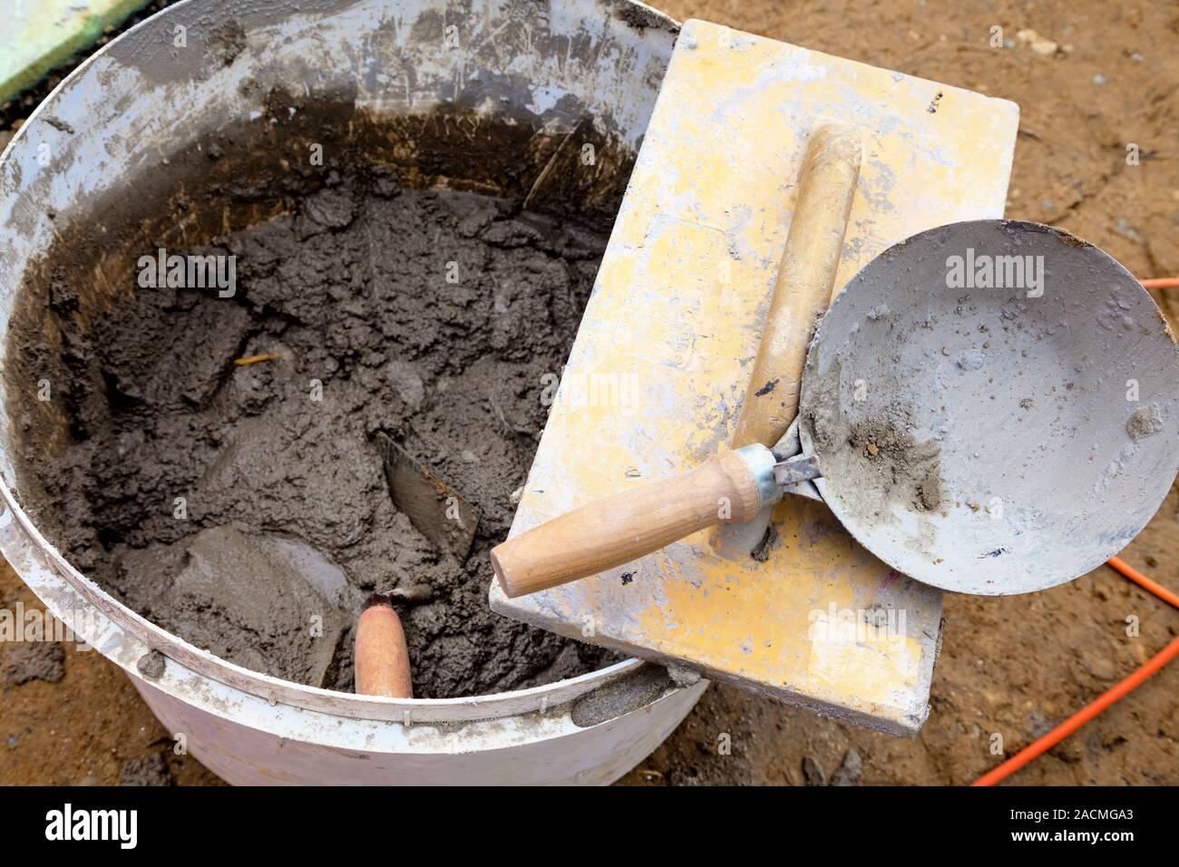 Bucket with mortar Stock Photo Alamy