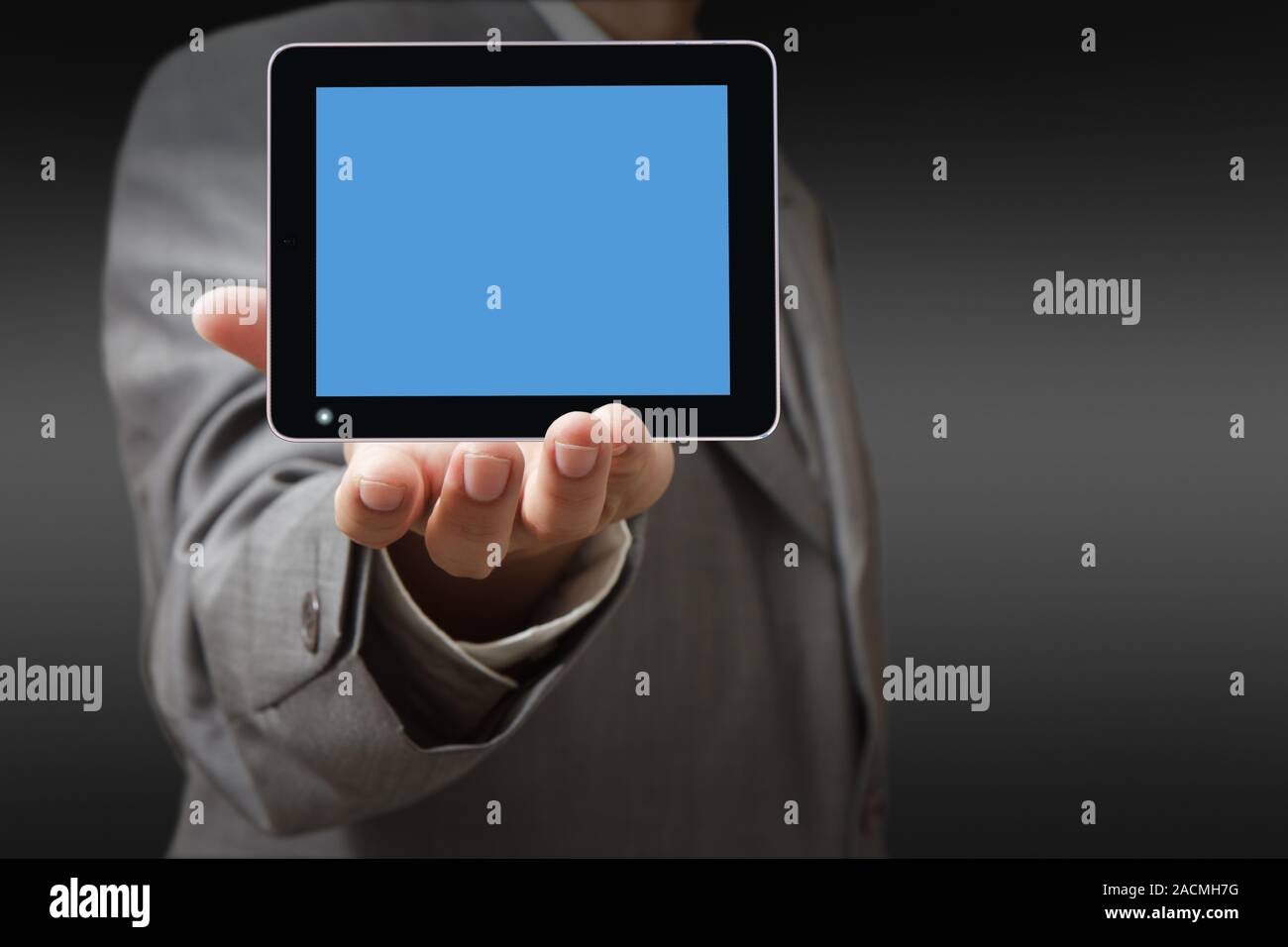 Businessman using his digital tablet Stock Photo