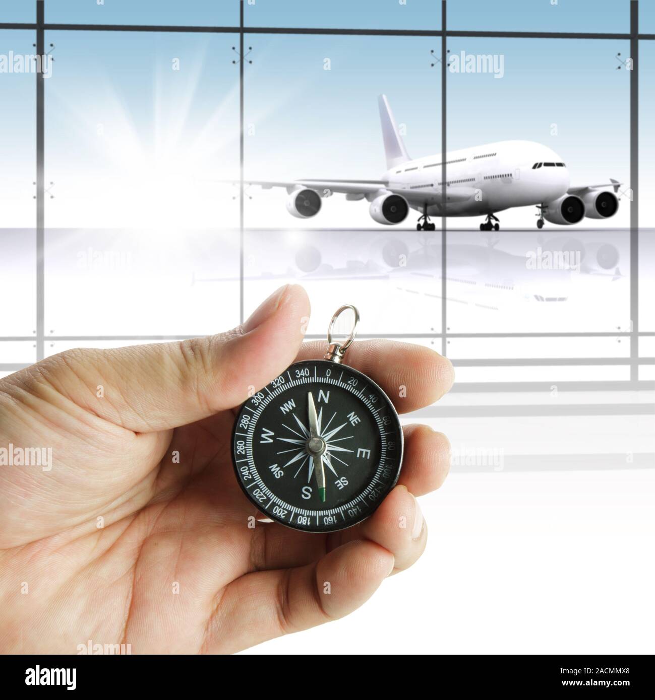 Hand holds the compass showing the right direction Stock Photo Alamy