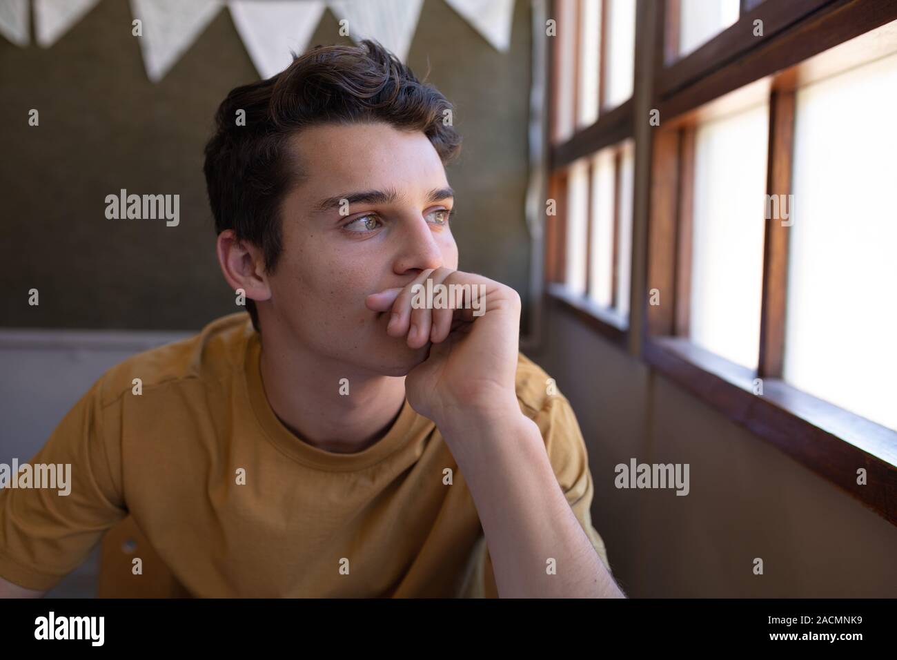 Teenagers in school classroom Stock Photo - Alamy
