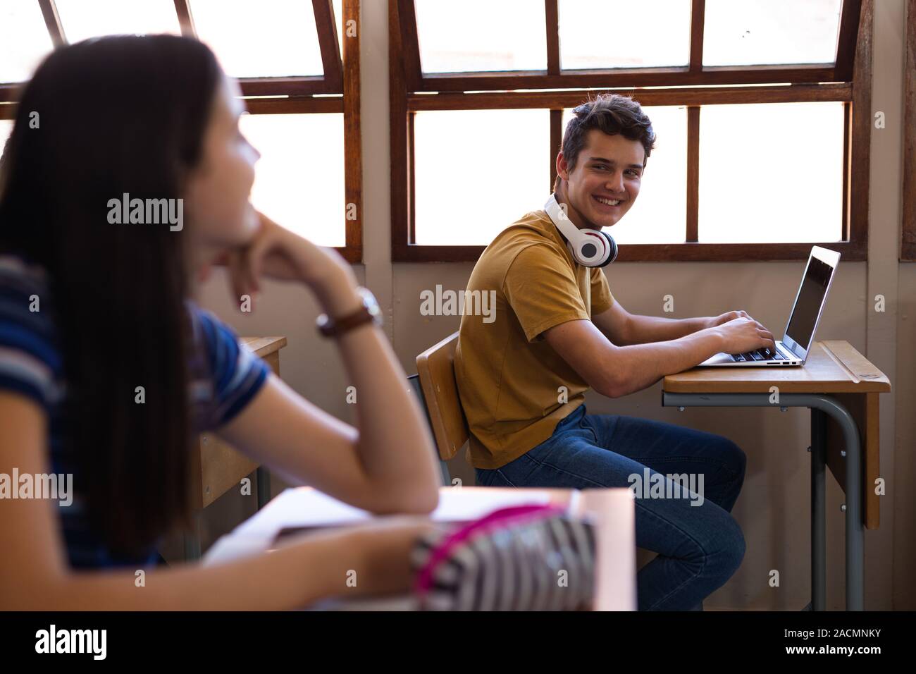 Teenagers in school classroom Stock Photo - Alamy