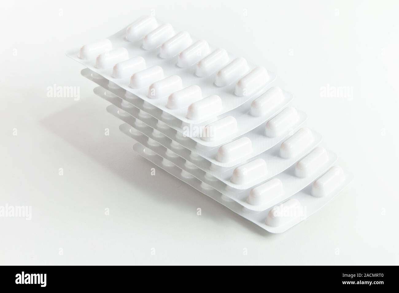 Blister stack packs of white pills Stock Photo