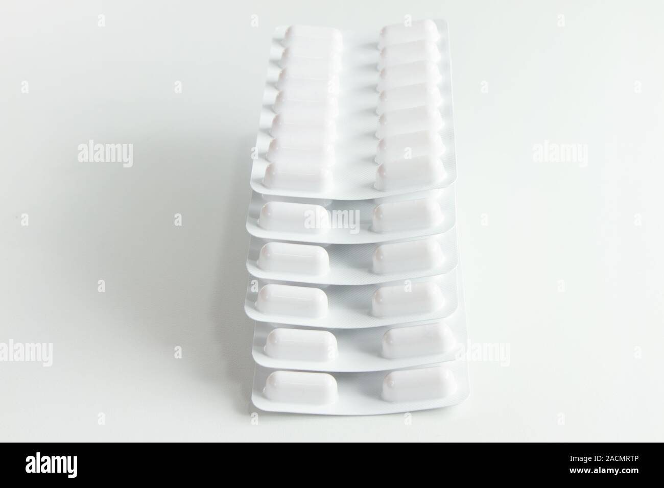 Blister stack packs of white pills Stock Photo