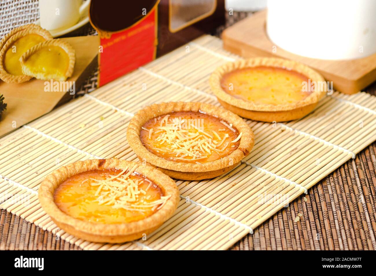 freshly baked pie with cheese toping on a natural wooden rustic Stock Photo
