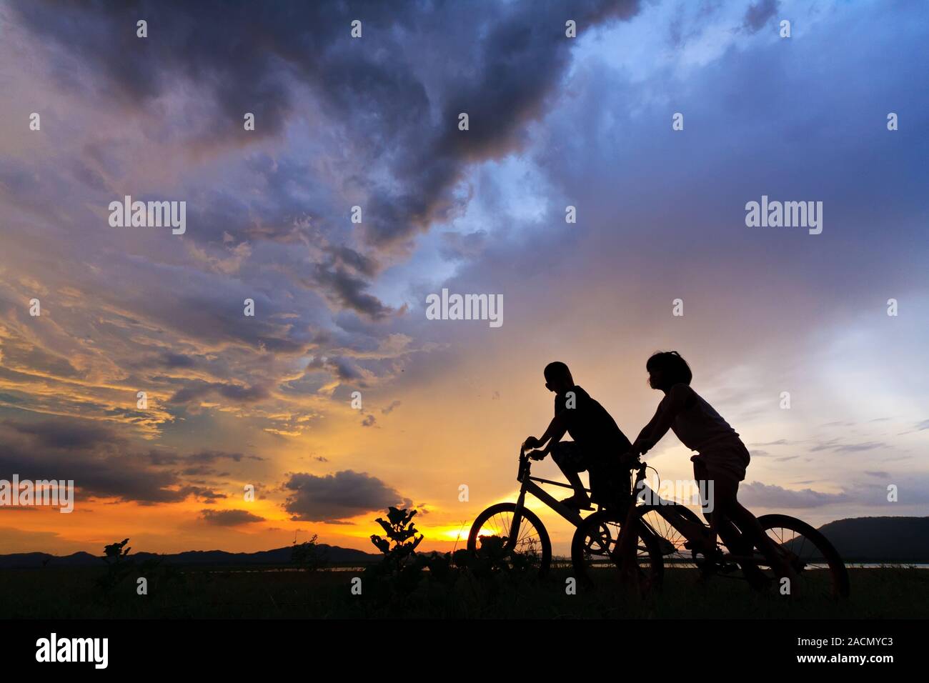 Beautiful Couple on bicycles Stock Photo