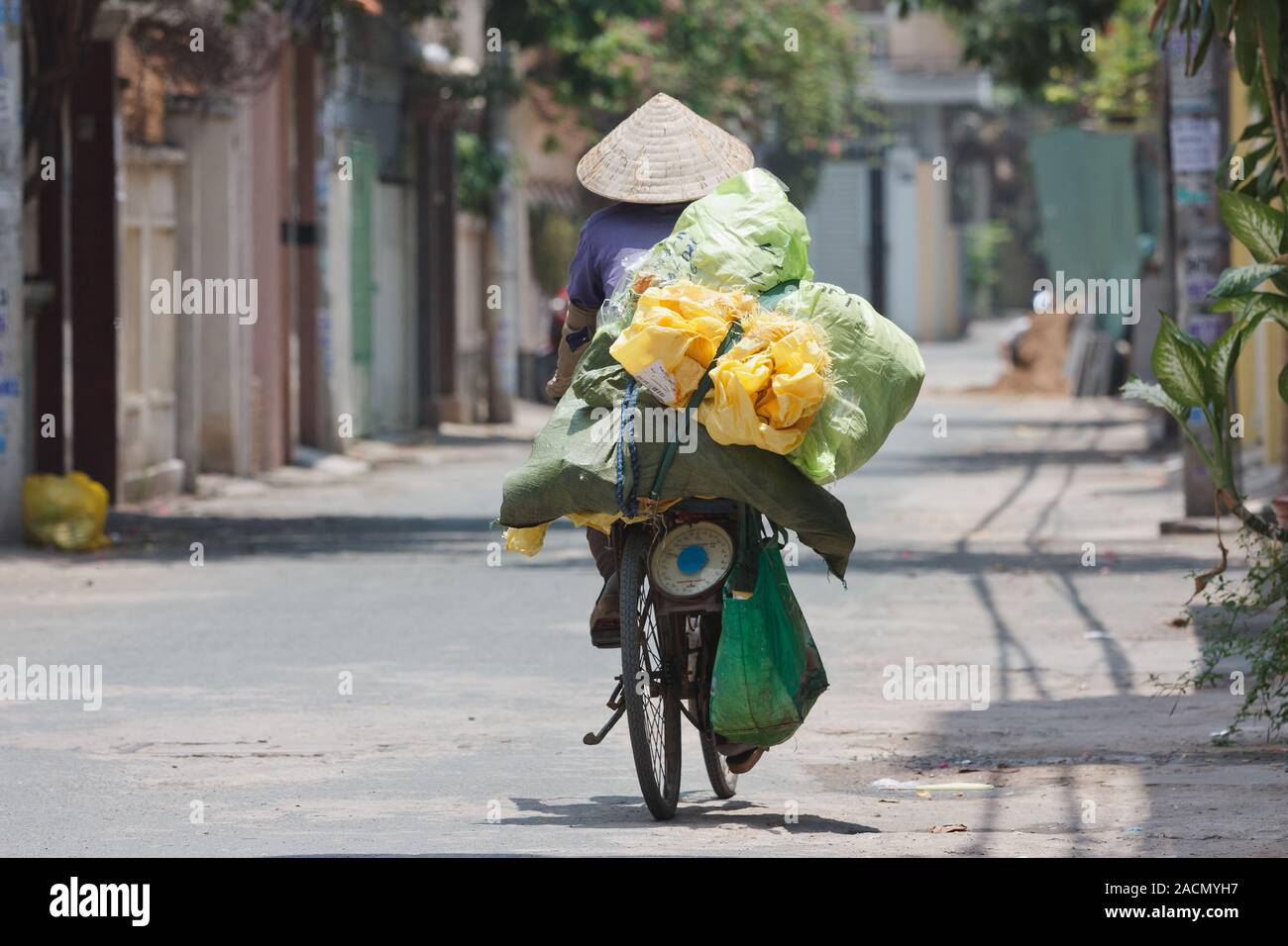 woman on a bike in vietnam Stock Photo