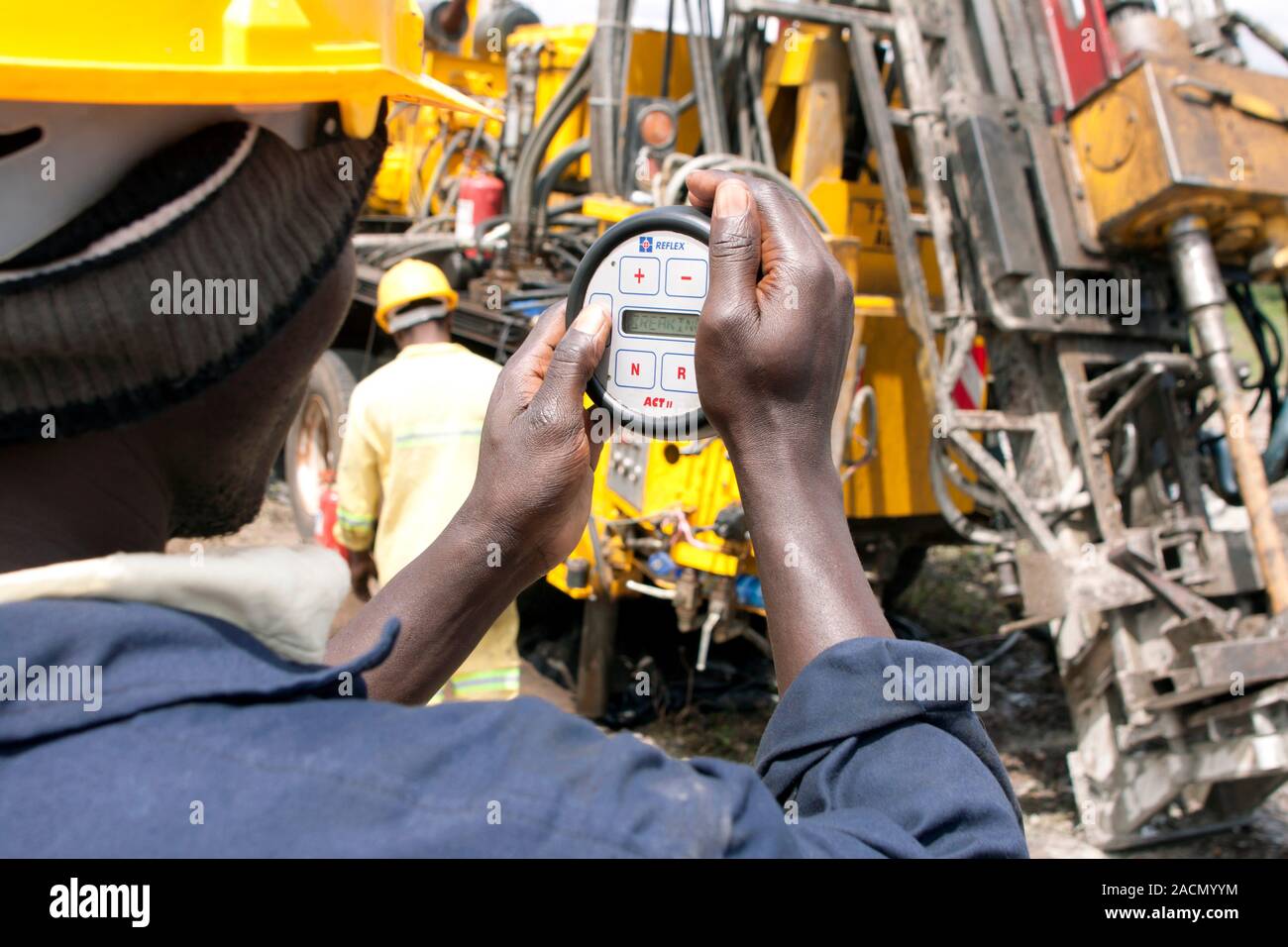 Mineral exploration drilling. Driller operating a