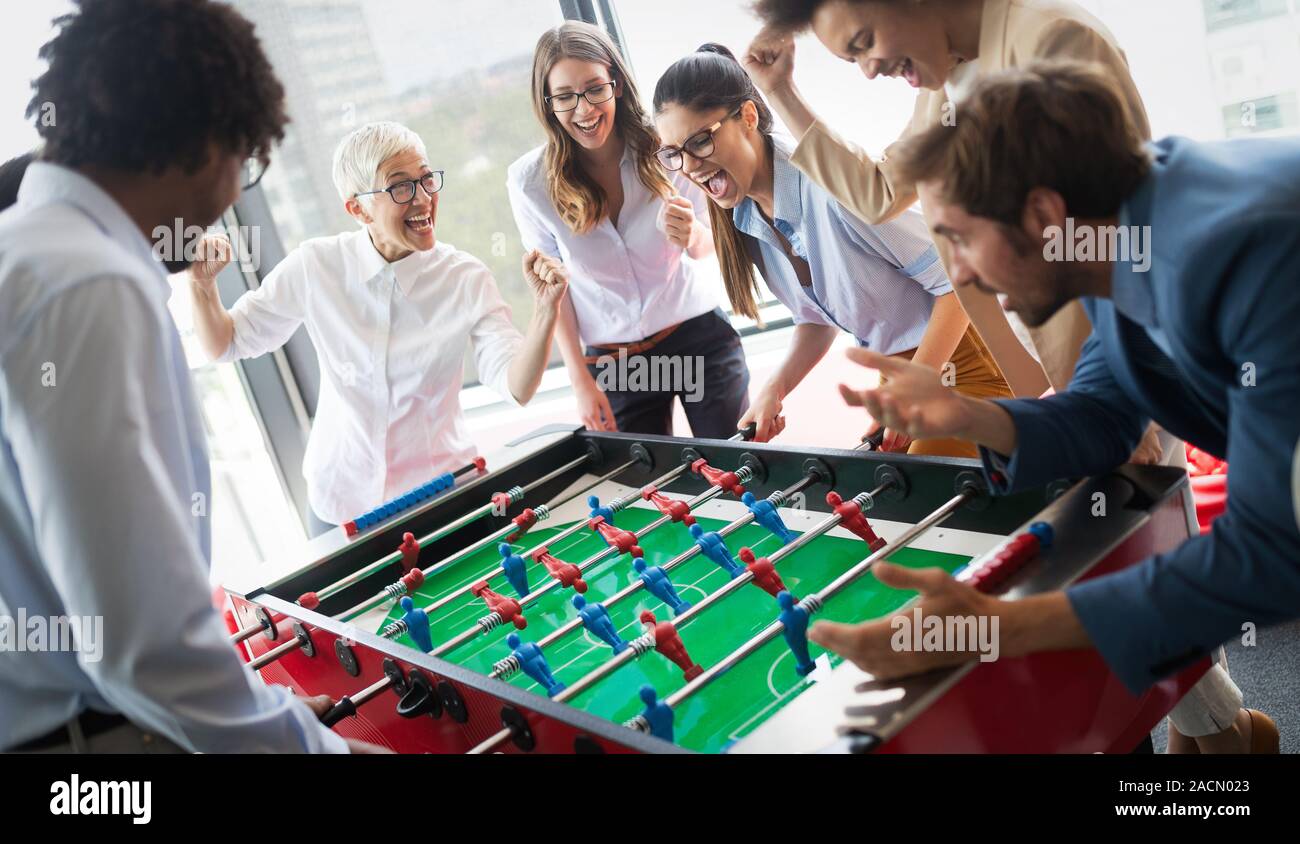 Excited diverse employees enjoying funny activity at work break, creative  friendly workers play game Stock Photo - Alamy