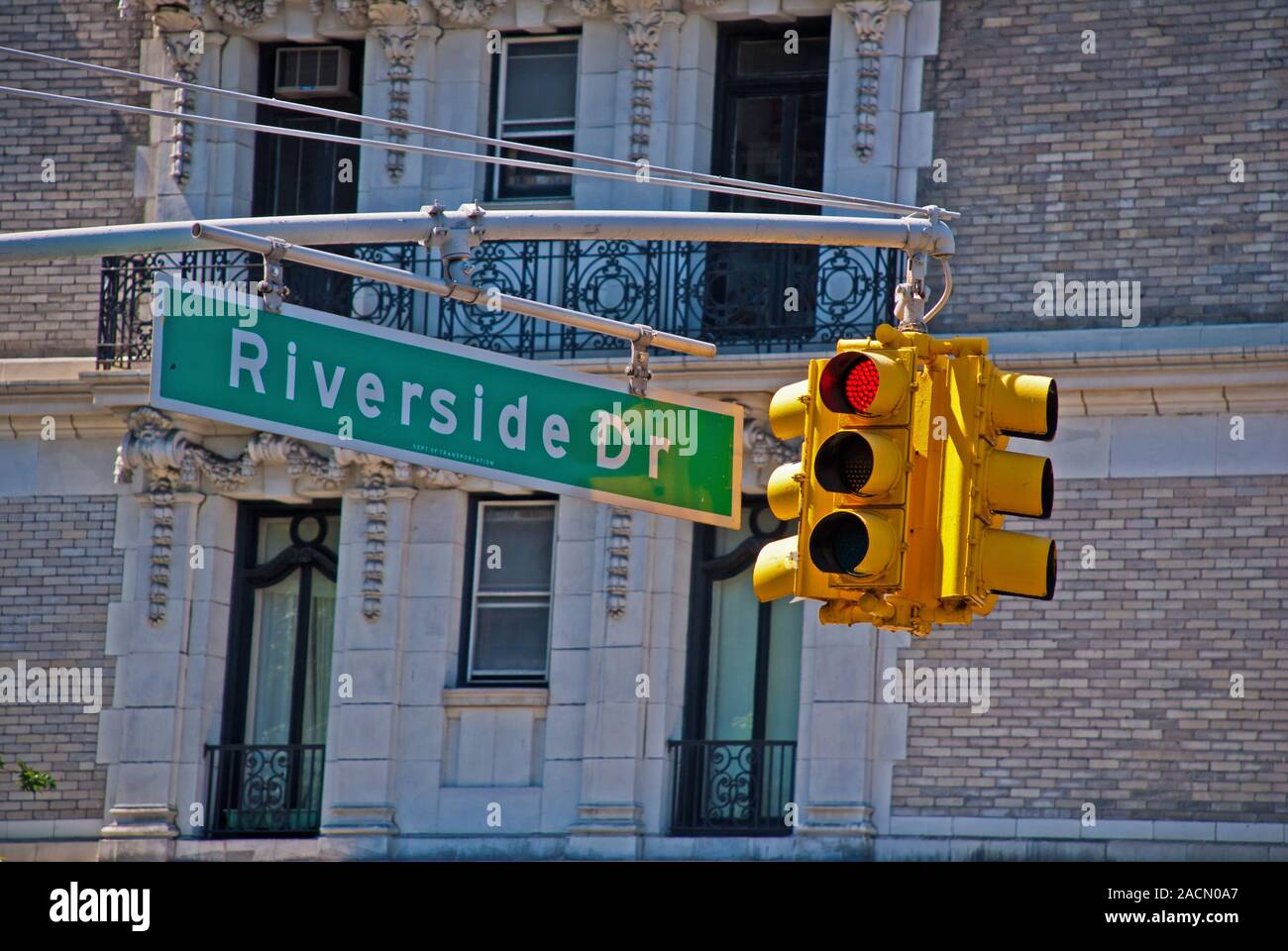 Red traffic light and road sign 'Riverside Drive', Manhattan Stock Photo