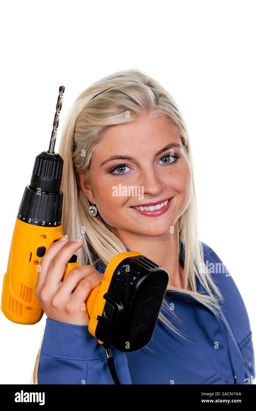Woman in blue work clothes with drilling machine Stock Photo