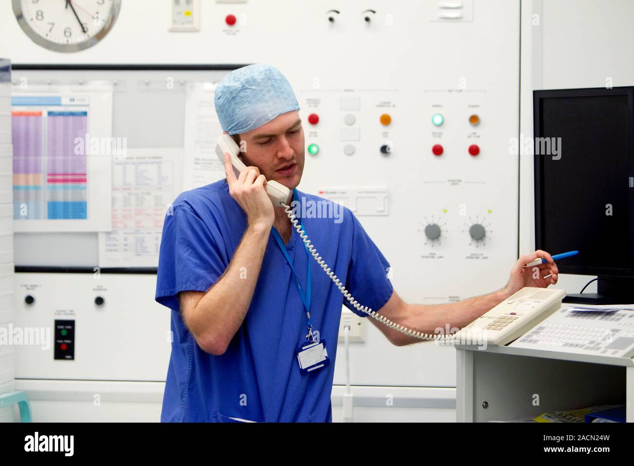 Surgeon on the telephone Stock Photo - Alamy
