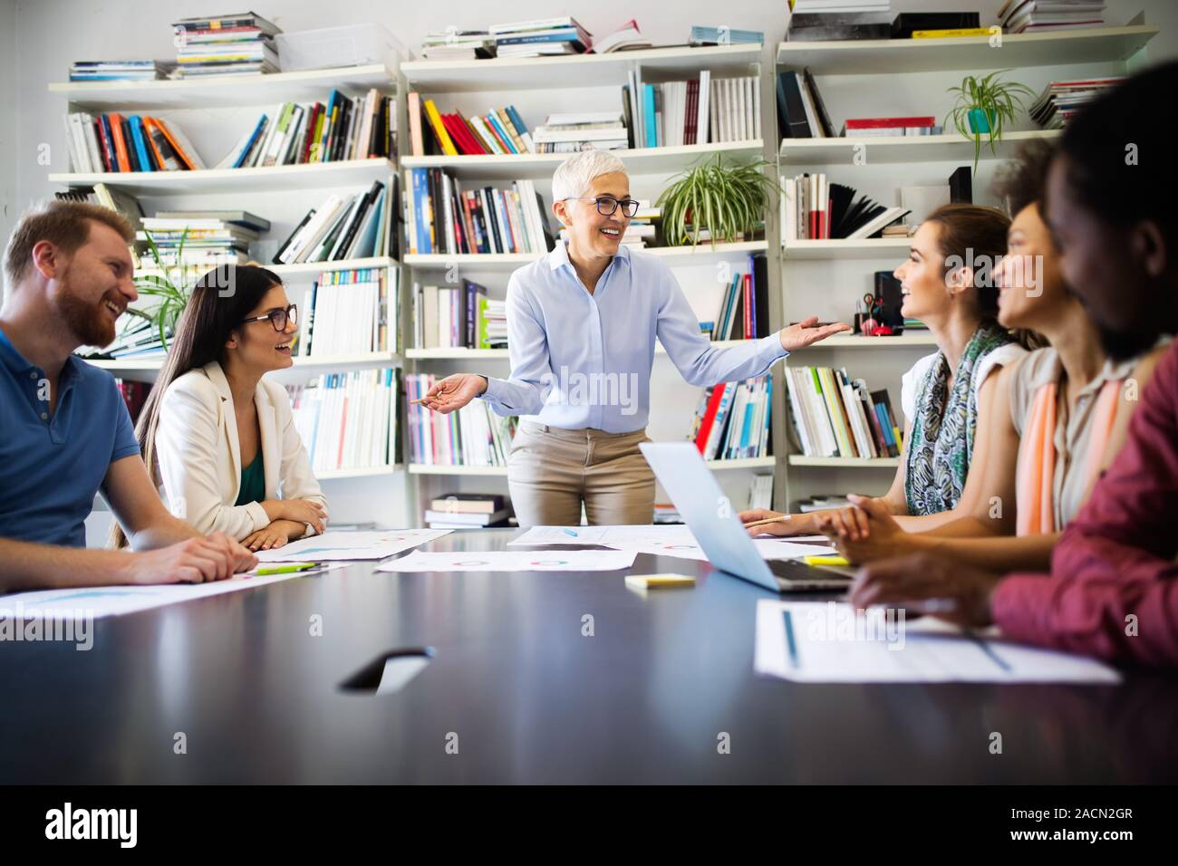 Successful group of business people at work in office Stock Photo - Alamy