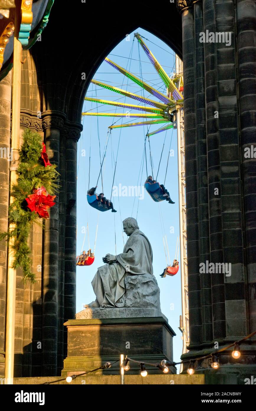 Walter Scott Monument and high Star Flyer fairground ride. Edinburgh