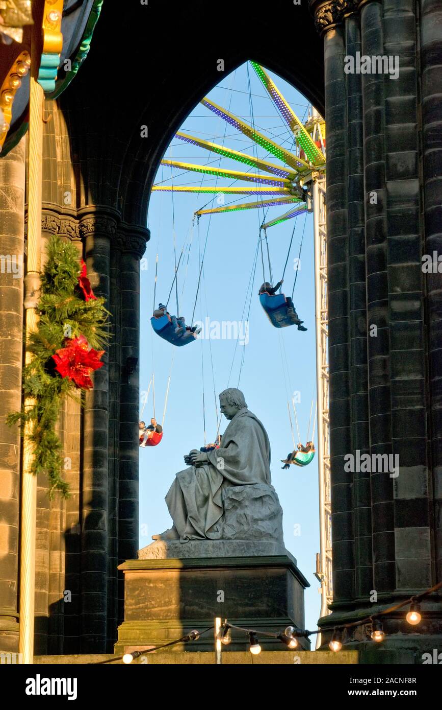 Walter Scott Monument and high Star Flyer fairground ride. Edinburgh